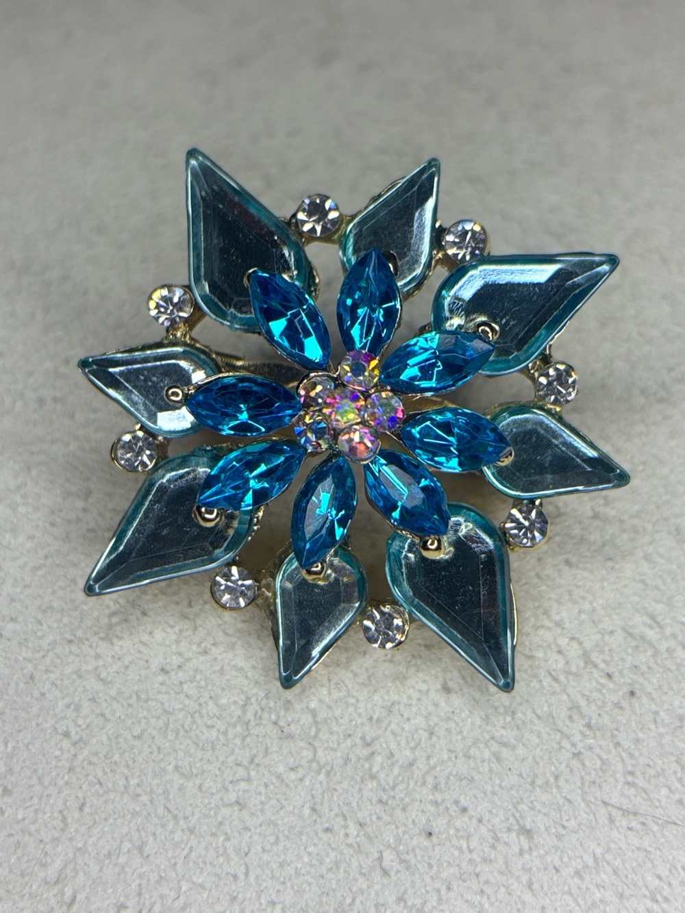 blue crystal glass starburst brooch